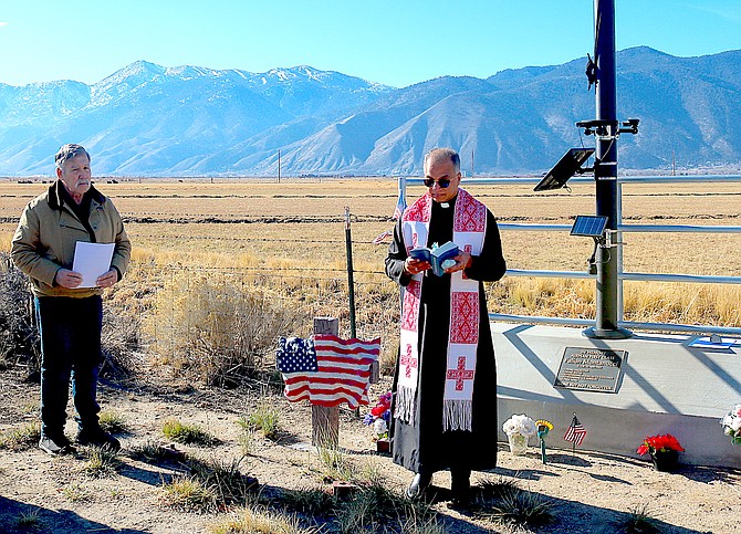 Eddie Montanucci listens as St. Gall Father Father Biju Malancheruvil blesses the monument to Fallon Montanucci on Dec. 3.