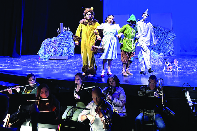 Dorothy, portrayed by Elaine Lewis at last week’s dress rehearsal, sets off with her friends to meet the Wizard of Oz. In the musical presented by Greenwave Theatre, Zander Lewis portrays the Cowardly Lion, Dawson Juliet is the Scarecrow, Miles Henning is the Tin Man, and Sage plays Toto.