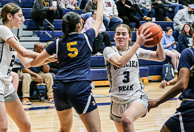 The Glacier Peak Grizzlies swatted the opening jump, took three steps, drained a three-pointer and never looked back, mauling the Everett Seagulls 72 - 31.  
Senior guard Brynna Pukis drives the lane in the GP Grizzlies’ win over Everett on Wednesday, Dec. 4 on the Grizzlies Home Court.  Pukis played the first half, scoring six three-pointers and two free throws to lead all scorers with 20 points. Seagull junior guard Akira Shaw led Everett’s team in scoring with 15 points.
The  Grizzlies played an aggressive defense, holding the Seagulls to single digit points for most of the first half. Glacier Peak led 45 - 18 at halftime. The Grizzlies showed stellar shooting from the three point lines and in close to remain undefeated in the young season.