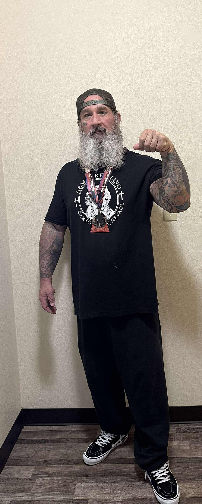 Terry Kilfian poses for a photo after taking third place in the 220 Masters Division at the Washington State Arm Wrestling Championships in early December.