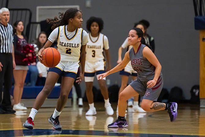 Everett Seagull guard junior Akilah Shaw looks at her avenues midcourt as Cascade Bruin guard senior Kaysha Agag approaches during the Dec. 13 girls game between the two teams held at Everett High School. The Seagulls pecked the Bruins, taking a 63 - 23 win on the home court as part of a doubleheader with the boys team playing later that night.
Everett, in the hypercompetitive 3A league, is having a 2-4 overall season so far as of Monday, Dec. 16. They’ve got an in-conference game at Snohomish this Friday, Dec. 20.
Cascade, in 4A, was 0-1 league, 1-4 overall as of Monday, Dec. 16. The team beat Marysville-Getchell for its season opener. They’re playing Jackson Wednesday, Dec. 18.