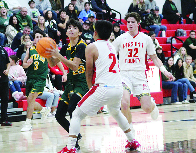 Battle Mountain’s Abraham Nevarez goes up for a shot during Friday’s 54-50 win over Pershing County in Lovelock.