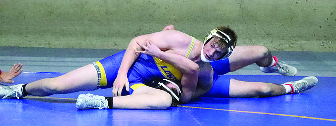 Lowry's Maddex Hislop completes his 157-pound match by pin..