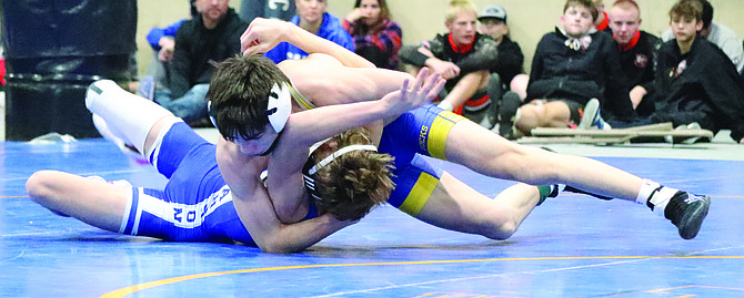 Lowry's Pete Bengochea pins his Carson opponent