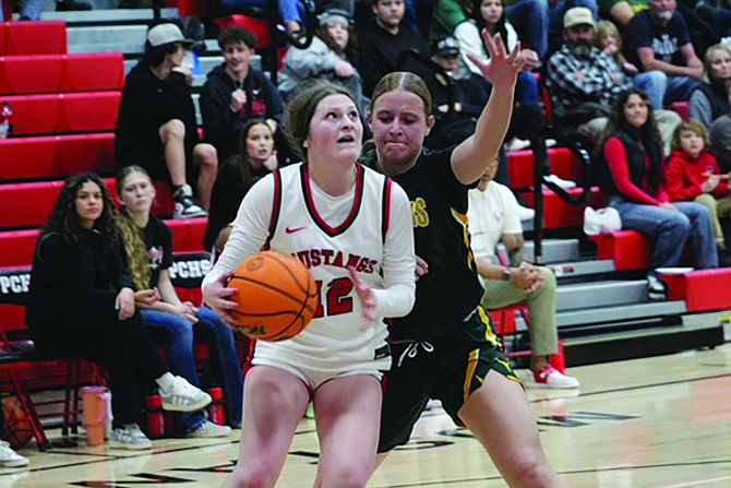 Pershing County's Kyra Cerini goes up for a shot during Friday's home game with Battle Mountain.