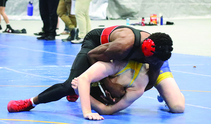 Pershing County’s Angelo Gibson gains the advantage in his match.