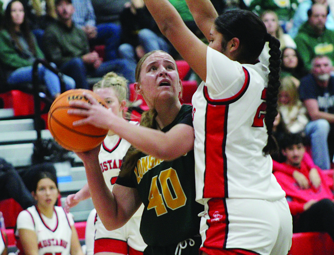 Battle Mountain’s Paitynn Johns  looks to go up for a shot during Friday’s 39-29 win over Pershing County in Lovelock.