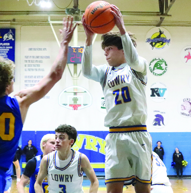 Lowry's Matthew Casalez comes down with a rebound in Friday's home game with South Tahoe.