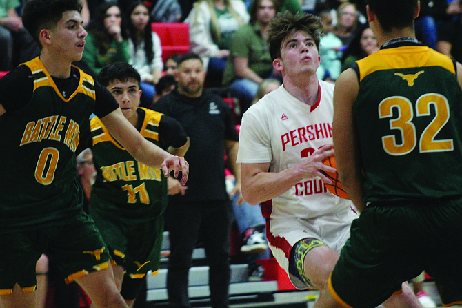 Pershing County's Travis Donaldson takes a shot against Battle Mountain on Friday night in Lovelock.