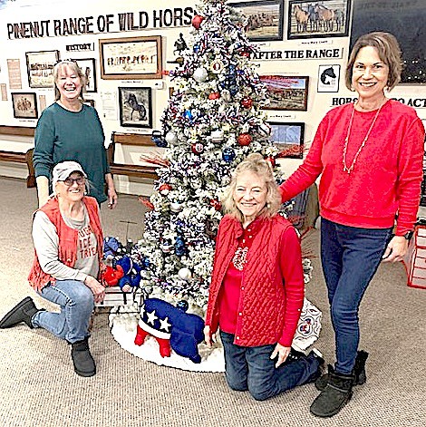 Douglas County Republican Women Janet Freixas, Gloria Darrington, Nancy Kjeldergaard and Judy Marsh pose with their entry in the Gallery of Trees at the Carson Valley Museum & Cultural Center.