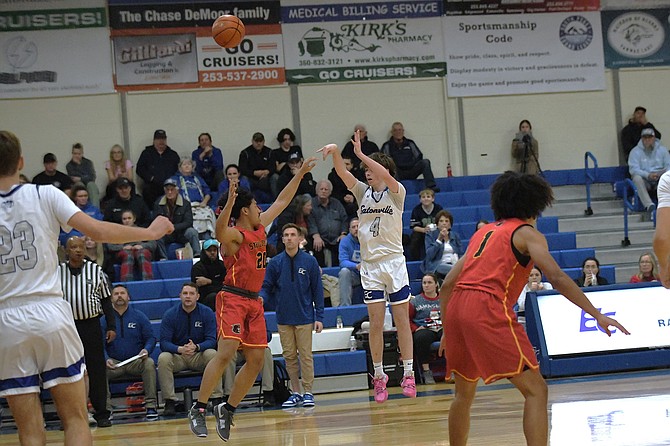 Eatonville's Lowell McWright, pulls up for a jump shot over a Steilacoom's Kano Kaeka during a heated matchup. McWright went on to hit six three-pointers on the night, but the Cruisers ultimately fell to Steilacoom, 75-73.