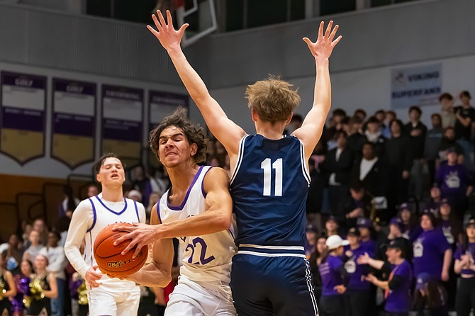 Lake Stevens junior Royce Rabb looks for a way around Glacier Peak junior Reed Nagel putting up a block during the boys game Friday, Dec. 20 at Lake Stevens.
The Glacier Peak Grizzlies won 73-46, taking their second conference win of the season. Lake Stevens and Glacier Peak have their next rematch Jan. 24 on Glacier Peak’s home court.