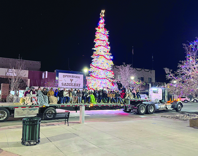 Oasis FFA students sing carols while being driven through the downtown area.