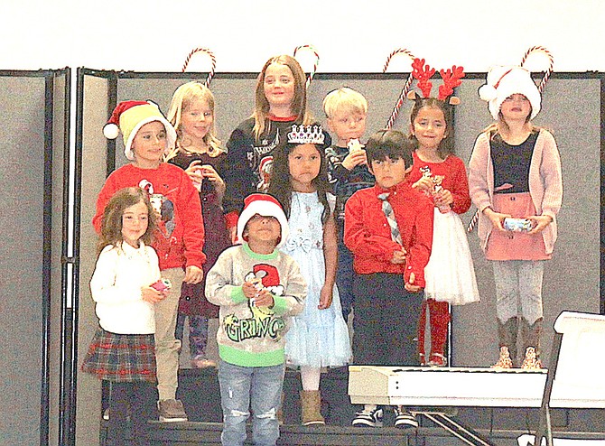 Kindergarteners show of their grins during the performance of “All I want for Christmas is my two front teeth,” at Gardnerville Elementary School’s Winter Wonderland concert on Dec. 19.