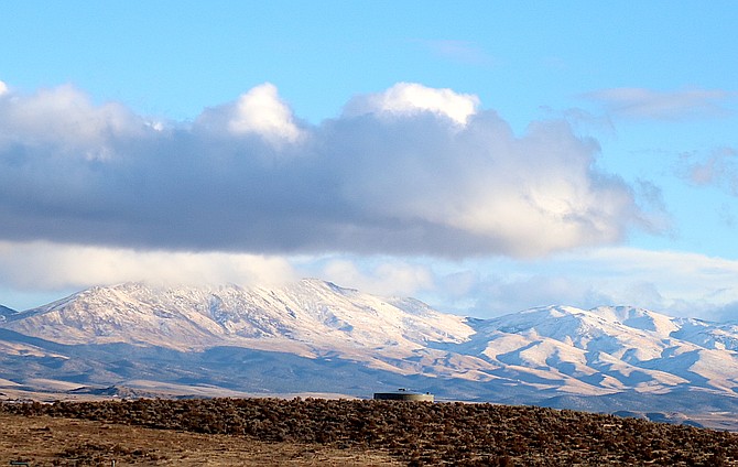 Mount Siegel was wreathed in clouds on Christmas Eve after the Pine Nuts received a little snow.