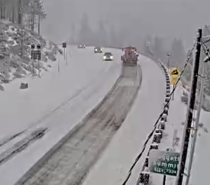 A state snowplow heads down the Valley side of Kingsbury Grade in an nvroads.com screen capture.