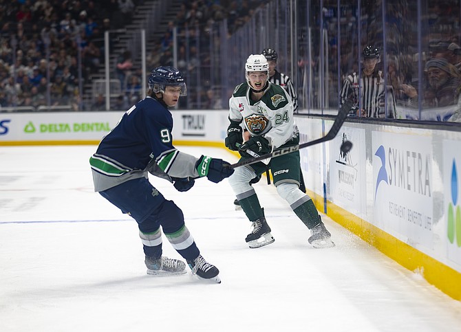 Everett Silvertip defenseman Tarin Smith of Saskatchewan (white jersey) and Seattle Thunderbird forward Coster Dunn of Edmonton, Alberta pursue the puck during the Western Hockey League (WHL) matchup between Seattle and Everett on Friday, Dec. 27 at Climate Pledge Arena in Seattle for the Battle of the Sound.
The Silvertips took a 5-3 win over Seattle that night. The Tips then took a 6-1 win at home against Seattle Saturday, Dec. 28. Their game Dec. 31 happened after press time.
At press time, the Silvertips led the WHL conference standings at 27-5, ahead of 
Prince George at 20-9. The Tips’ next home game will be Saturday, Jan. 4 at 6 p.m. hosting the Victoria  Royals in Everett’s Angel of the Winds Arena.