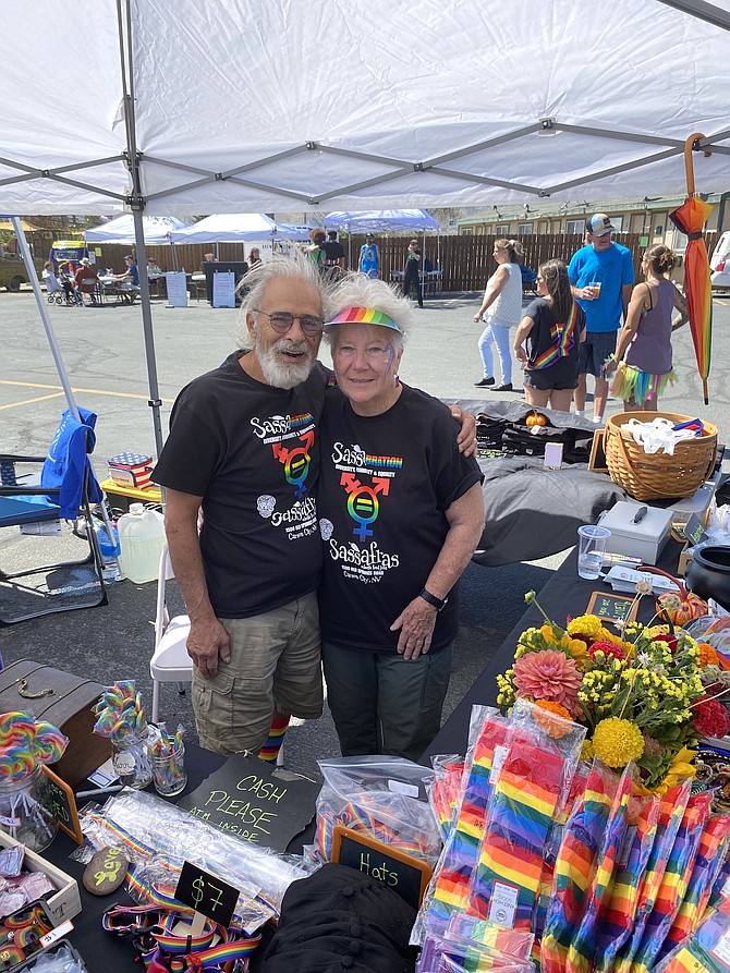 Charlie Abowd and Linda Marrone working the booth for Sassafrass at the annual Sassabration, one of their favorite fundraisers.