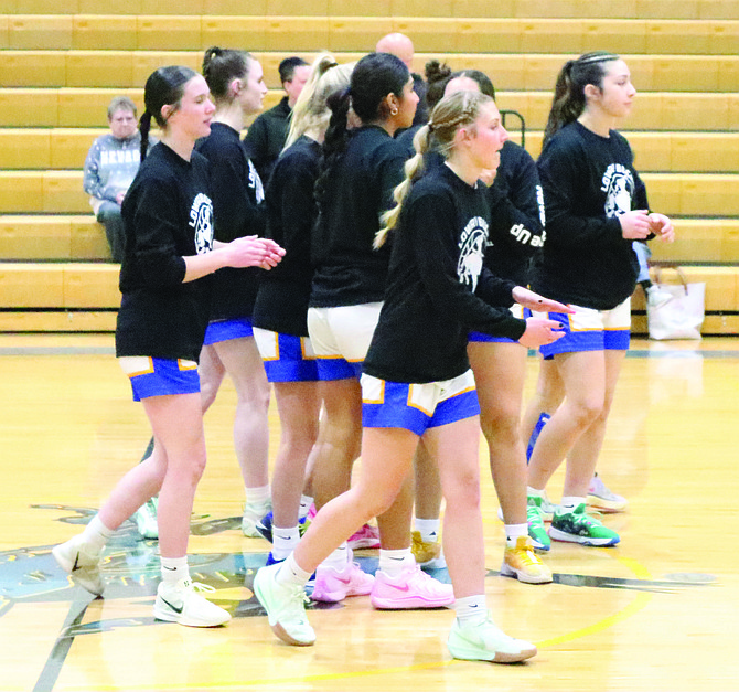 The Lowry High School girls basketball team prepares for its game with Damonte Ranch this past Saturday afternoon in Winnemucca. Lowry won 59-49.