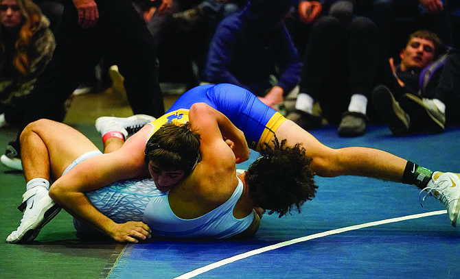 Lowry's Jhett Harber scores back points in his fifth-place match at the Sierra Nevada Classic against Sutter's Richard Creer. Harber won the match 17-1.