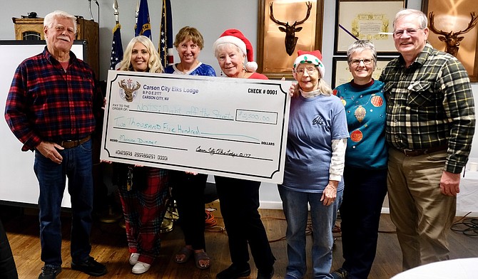 From left: Deacon Craig LaGier, Jodi Miller, Donna Spelts, Linda Marrone, Nancy Haffey, Deacon Veronica Galas, and Don Wingfield.