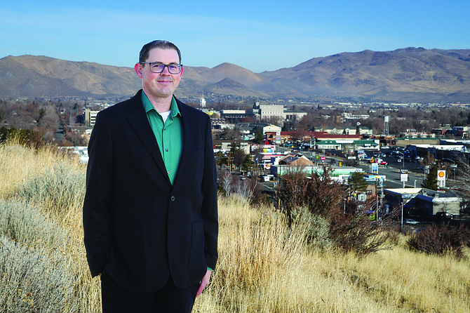 Eagle Valley Publishing owner Adam Trumble stands above Carson City late last year.