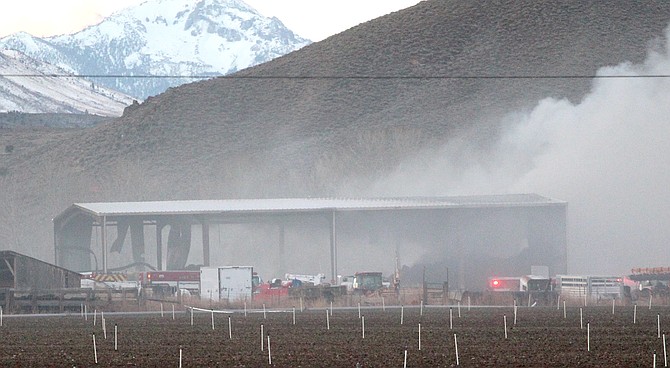 Hay burns in an early Monday fire on the Settelmeyer Ranch south of Gardnerville.