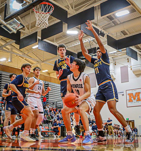 Monroe Bearcat senior Dylan Hall waits patiently for a shot in one of his 14-point game total during the game against the Everett Seagulls Friday, Jan. 3 in Monroe. 
The Monroe Bearcats beat Everett, 52 - 42 in the bookend to a Varsity double header. The Monroe girls won their game 39 - 17 over Everett that night. 
Monroe’s boys team played a controlled and patient backcourt then dashed for the net and the score.  The Seagulls ramped up their defense but this led to fouls turning 2-point shots into possible 4-point scores.  Everett Seagulls senior Noah Parker led all scorers with 21 points.  Monroe’s Kieren Greear tossed in 13 and Junior Chayce Waite-Kellar added 12.