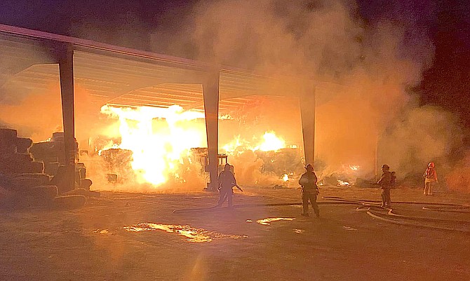 Firefighters at the scene of a barn fire south of Gardnerville early Monday. Photo by Annalyn Settelmeyer