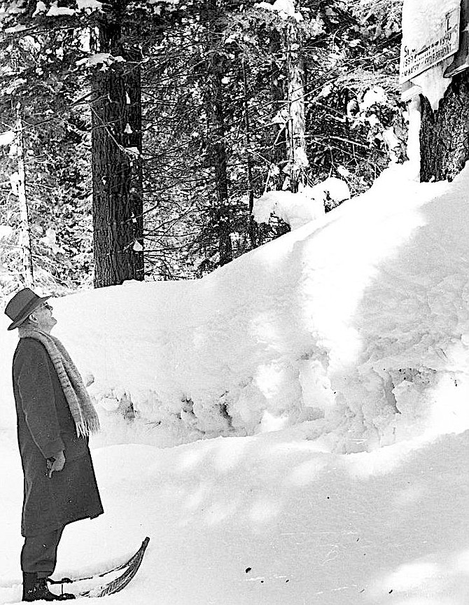 Dr. James Church viewing Tahoe snow levels sign. Credit: NC96_22_50_5_2, James Edward Church Papers Series 22, Special Collections and University Archives Department, University of Nevada, Reno.