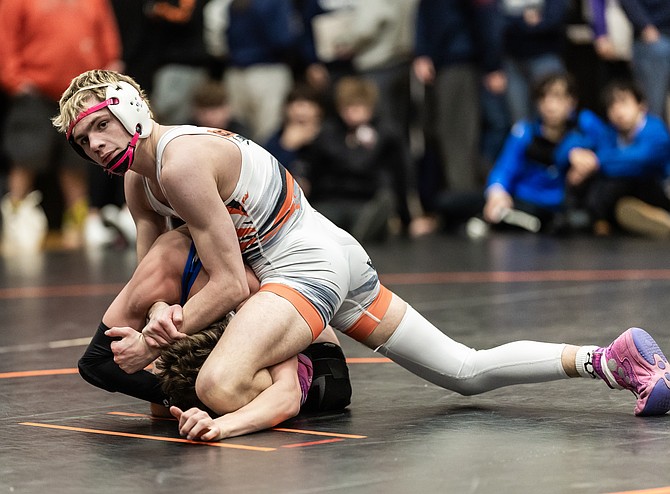 Douglas High senior Cody Highfill works atop an opponent, during the second annual Steve Deaton Memorial Tournament Saturday. Highfill went 4-0 at 120 pounds, winning the bracket.