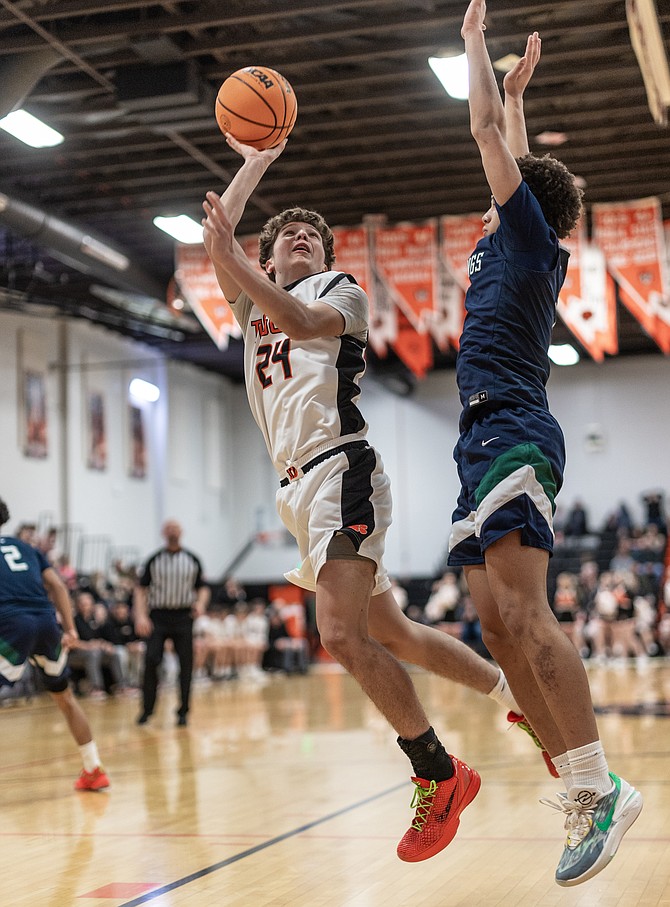 Daron Kizer (24) puts up an off-balance shot against Damonte Ranch Friday night. Kizer had 14 points in the Tigers’ 70-69 win.