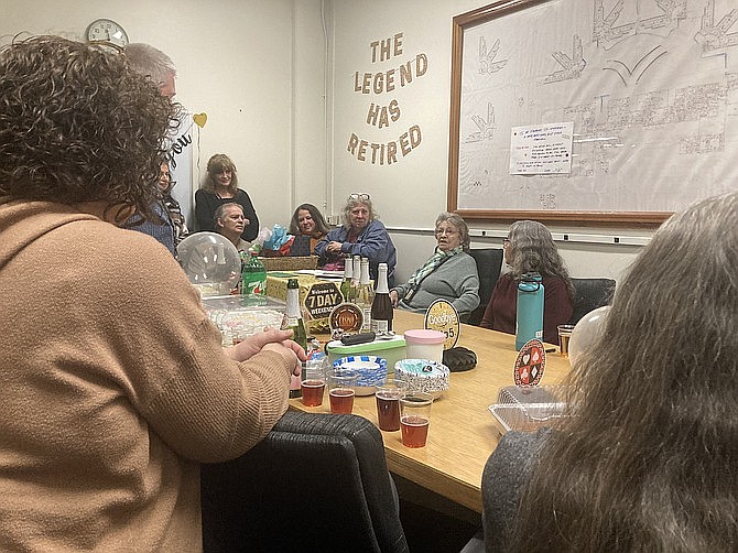 Gloria Hopkins, second from the right with green scarf, speaks during the party Dec. 31 in the Twin Rivers Unit of Monroe Correctional Complex.