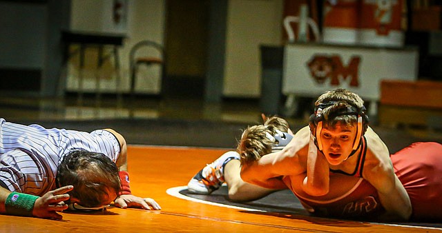 Snohomish 126-pound class Vitali Stayanov works an elbow on Bearcat Lucas Hauswald (facing camera) on the way to a Panther decision win during the matchup of Snohomish and Monroe Wednesday, Jan. 8 on Monroe High’s mats. 
The Monroe wrestlers made a good start with two pins in the first two bouts. The remainder was a Snohomish rumble with the next six bouts being two pins and four decisions favoring Snohomish.  The final score was 61 - 16.
Snohomish stood 2-1 (1-1 conference) for the season as of Jan. 10. Monroe is winless so far, at 0-2 (0-2 conference).