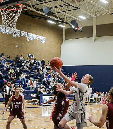 Glacier Peak junior Dylan Gordon floats a shot for 2 during first quarter action against the Cascade Bruins Wednesday, Jan. 15 on Glacier Peak’s home court. Glacier Peak trounced Cascade 56 - 12. Grizzly power Forward Brynna Pukis hit 11 points, including three 
3-pointers, adding to the 29 - 1 first period.  The Cascade Bruins were  held to 1 point until the closing minutes of the first half when they added 5 to make the half 42 - 6.   
The Bruins were led by Junior Isa Palmer with 6 from netting two 3-pointers.
In Wesco 4A, Glacier Peak stood 6-1 conference, 10-5 overall as of Sunday, Jan. 19.