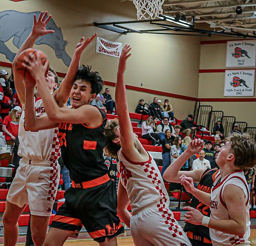 Snohomish Panthers senior Tyler Gildersleeve-Stiles soars for 2 of her 14 points over Everett defenders Akilah Shaw and another during first period play of the Panthers’ trampling over the Seagulls 65 - 12 on the Panther home floor.  The Seagulls played a spirited defense but were frustrated by their shooting, scoring 3 in the first quarter, 4 in the second quarter and 12 overall. The Seagulls were led by  sophomore Beatrice Lane with five points.
In the evening opener, the Snohomish Boys played a hard-fought battle against the Everett Seagulls, winning in the closing seconds 45 - 44.  In the final minutes both coaches used many timeouts to control the flow and pace of the game.
The Snohomish girls next play Marysville-Getchell on Wednesday, Jan. 22, then host Marysville-Pilchuck on Friday, Jan. 24. The home game against Marysville-Pilchuck starts at 6:30 p.m.