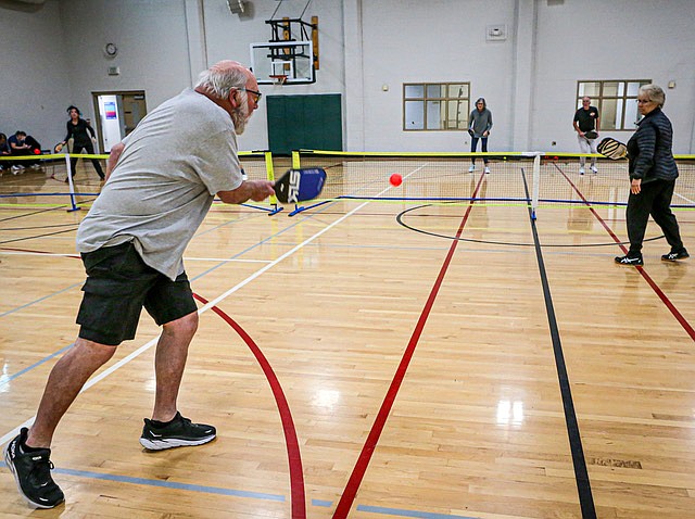 A group of four play pickleball on one of the courts inside the Monroe Y on its basketball court the morning of Sunday, Jan. 19. Rich and Nancy, foreground, volley with Eileen and Mark. All are from the Snohomish area and said they play often at the Y. The courts were all active with teams of players.