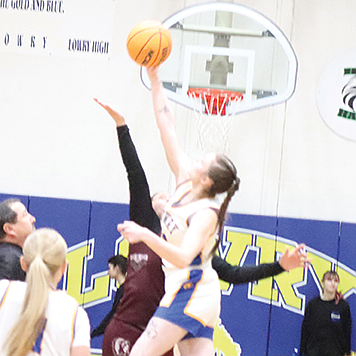 Lowry's Khlloe Shorey wins the opening tip against Elko.