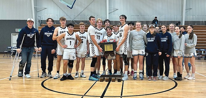 The Oasis Academy boys and girls basketball teams defeated Coral Academy on Saturday to retain the Ore Cart trophy.
