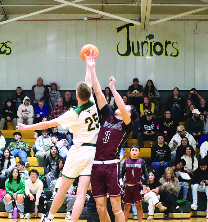 Battle Mountain's Aaro Vainiotalo wins the opening tip against West Wendover.