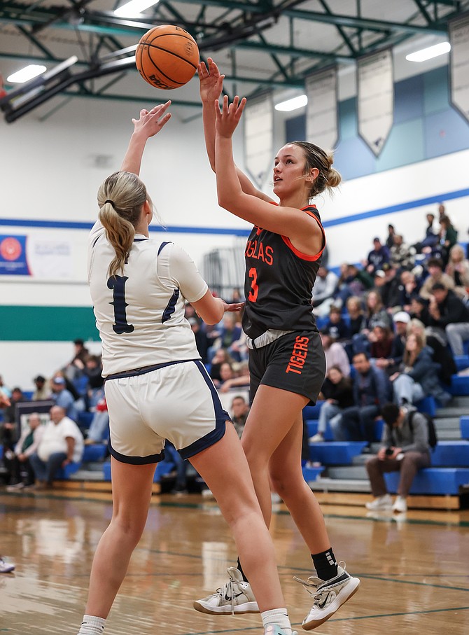 Tiger senior Annie Hill lofts a pass into the paint Tuesday at Damonte Ranch. The Mustangs won in overtime, 54-47.