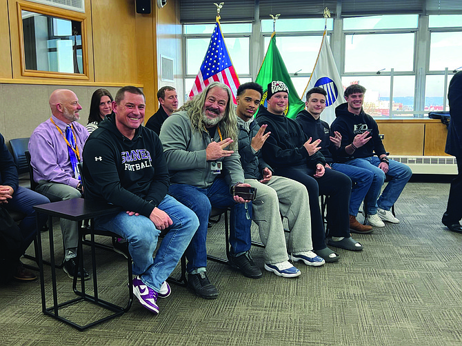 Head Coach Keith Ross (second from left) and Sumner Spartans’ four captains (right) received the council’s proclamation.