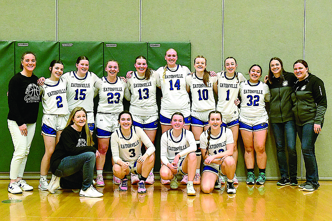 The Eatonville Lady Cruiser basketball team and coaches posed for a photo following their thrilling 51-48 victory over Fife to secure their spot in the WIAA State tournament.