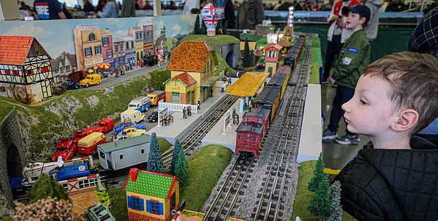 Beckham, age 5 from Snohomish, in the foreground, enjoys the colorful model trains at the 32nd Washington State Train Show and Market Place. He came with his brother and grandmother. The event, presented by the United Northwest Model Train Club of Seattle, was at the Evergreen State Fairgrounds in Monroe on Saturday and Sunday. A large crowd of rail buffs filled three buildings on the Fairgrounds. The show’s proceeds benefitted 4-H Youth Development programs in the county.