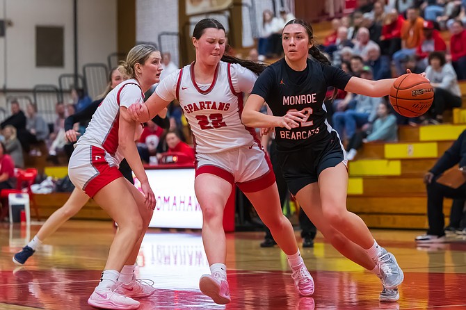 Monroe guard Mya Mercille tries to fend off Stanwood Spartan guard Jazmyn Legg during the Wesco 3A Districts tournament game Tuesday, Feb. 18 held at Marysville-Pilchuck High. The Spartans won 59 - 41, dousing Monroe’s highly potent shot at taking the 3A District title.