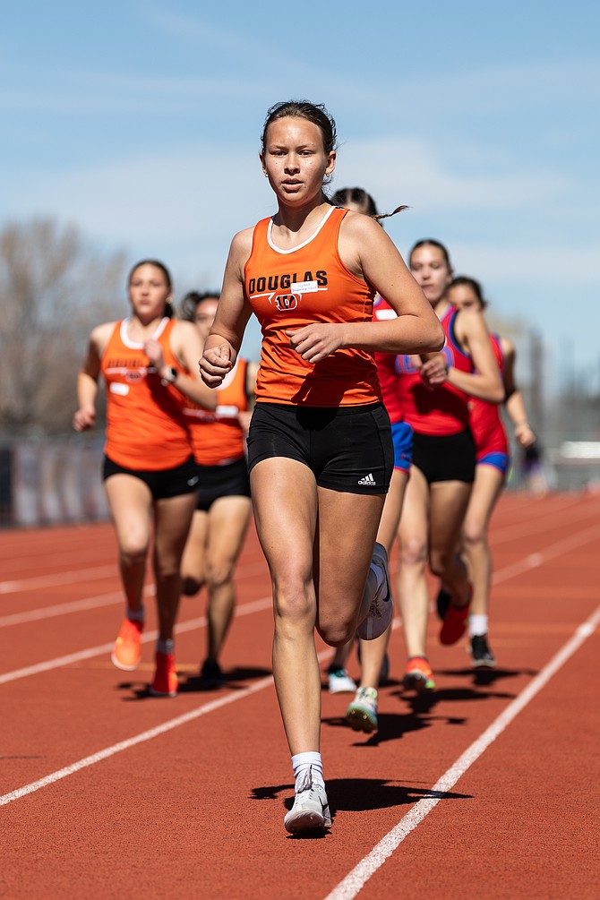 Douglas High’s Lucy Nord strides through a distance race Saturday at Douglas during the Tigers’ season-opening track meet. Nord won the 1,600 in 5:50.57.