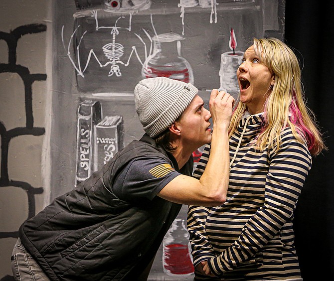 Improv player Spencer Langston peers in the mouth of player Leslie Lillie-Hamilton as part of an improvisational scene involving dentistry during Sky Performing Arts’ Wednesday night Improv group, which is small and happy to accept more players.