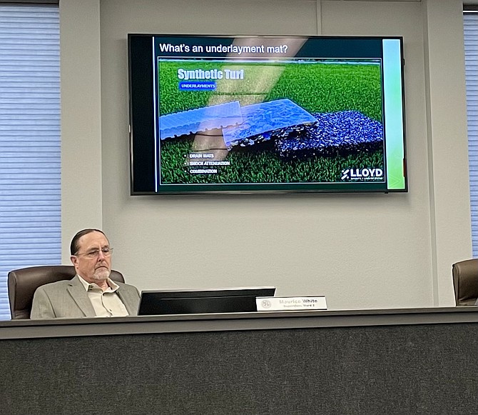 Supervisor Maurice White considers a synthetic turf project at Thursday’s Board of Supervisors meeting.