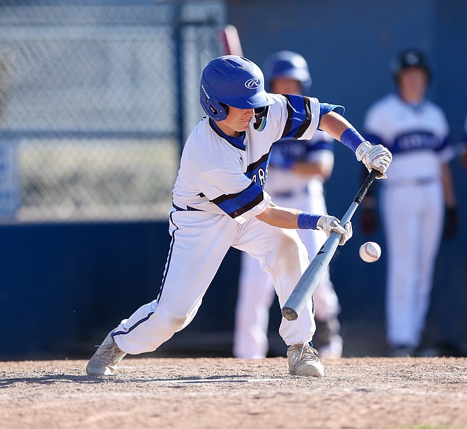 Carson High’s Chase Grundy lays down a bunt, during a contest last spring. Grundy and the Senators will be at home against Douglas Tuesday night, beginning at 6 p.m.