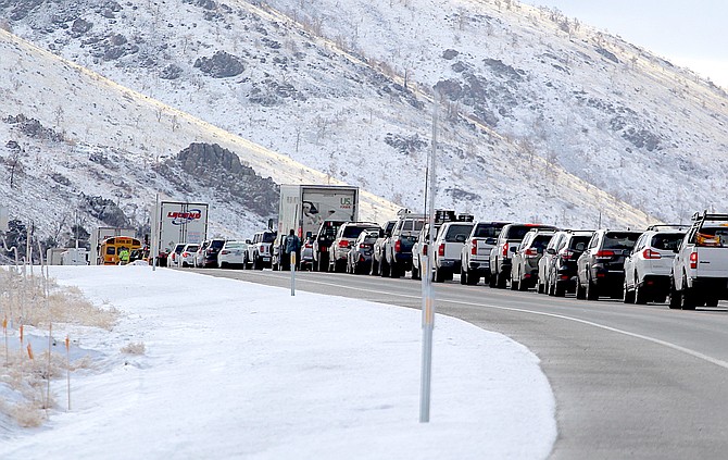 A long line of vehicles wait after a 7 a.m. collision on Highway 395 near Spring Valley in the Pine Nut Mountains.